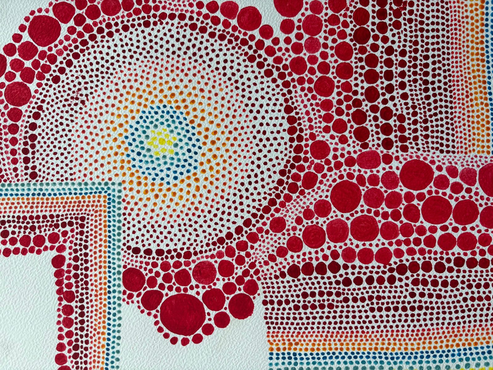 Dotwork painting of thousands of hand-placed red, orange and blue dots forming swirling clusters