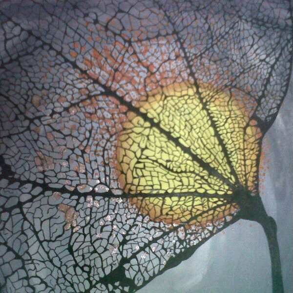 Skeleton leaf veins spread across a grey sky with a glowing golden circle of light behind them